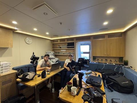 Editing and kit prep in the crew office on board