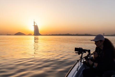 Filming from a tender at sunset